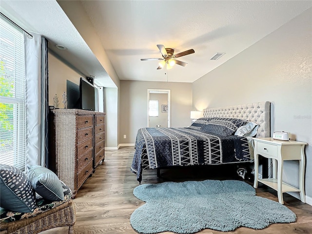 bedroom with ceiling fan and light wood-type flooring