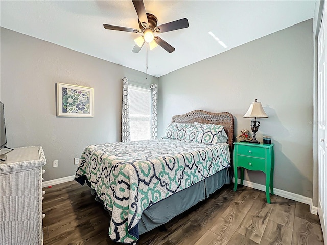 bedroom featuring dark hardwood / wood-style floors and ceiling fan