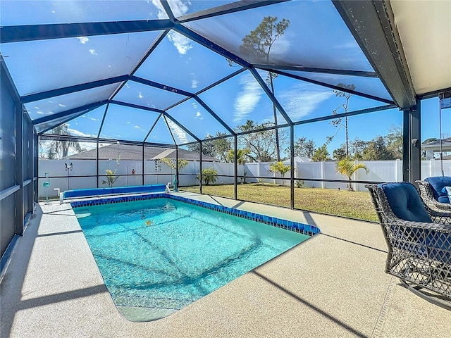 view of pool featuring a yard, a lanai, and a patio