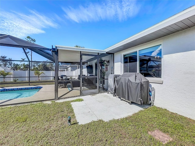 back of property with a fenced in pool, a patio, a lanai, and a lawn