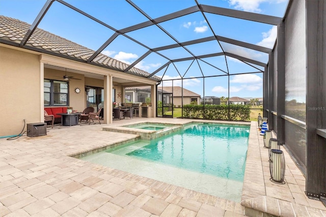 view of pool featuring an in ground hot tub, a patio, and a lanai