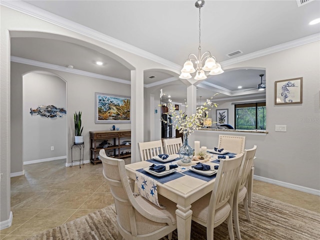 tiled dining room featuring ornamental molding and ceiling fan with notable chandelier