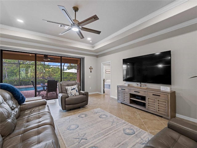 tiled living room featuring ceiling fan, crown molding, and a raised ceiling