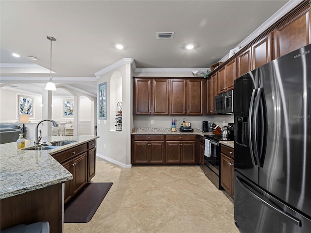 kitchen featuring hanging light fixtures, sink, stainless steel appliances, and ornamental molding