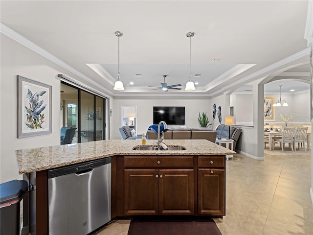 kitchen featuring ceiling fan with notable chandelier, dishwasher, a raised ceiling, and sink