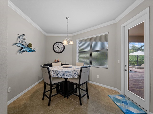 dining space featuring plenty of natural light, ornamental molding, and a notable chandelier