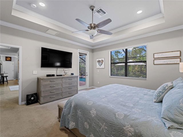 carpeted bedroom with ceiling fan, access to exterior, ornamental molding, and a raised ceiling