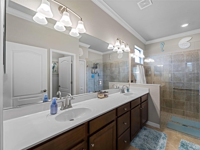 bathroom with walk in shower, vanity, tile patterned flooring, and crown molding