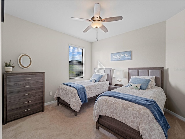 bedroom featuring light carpet and ceiling fan