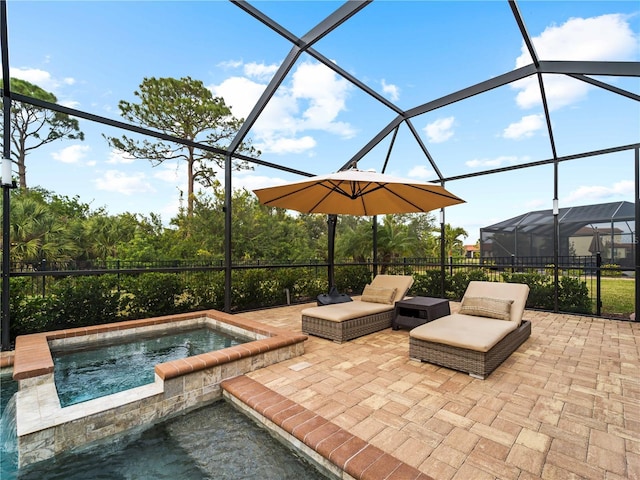 view of patio with glass enclosure and an in ground hot tub