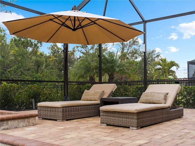 view of patio / terrace featuring a lanai