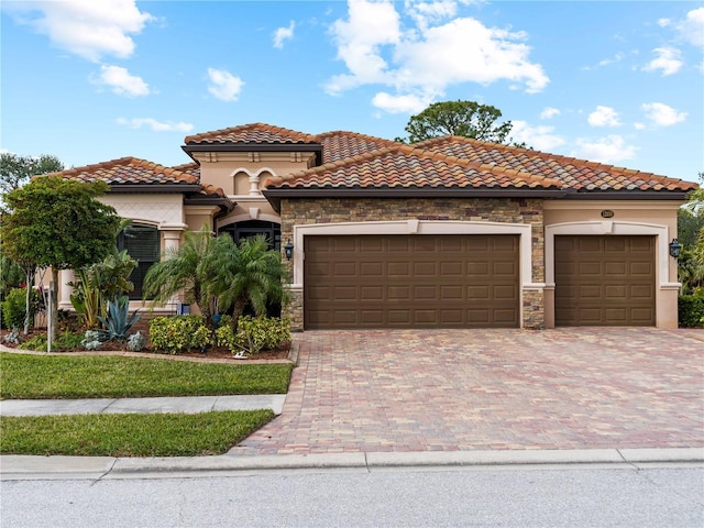 mediterranean / spanish-style home with a garage