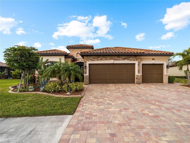 mediterranean / spanish-style home with a garage and a front yard