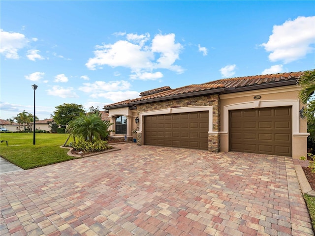 mediterranean / spanish-style home with a front lawn and a garage