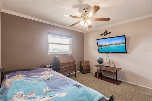 bedroom featuring ceiling fan, a textured ceiling, ornamental molding, and carpet floors