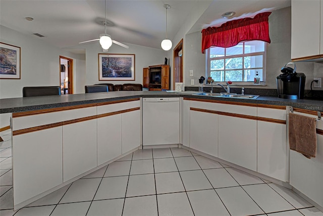 kitchen with white cabinets, sink, kitchen peninsula, vaulted ceiling, and white dishwasher