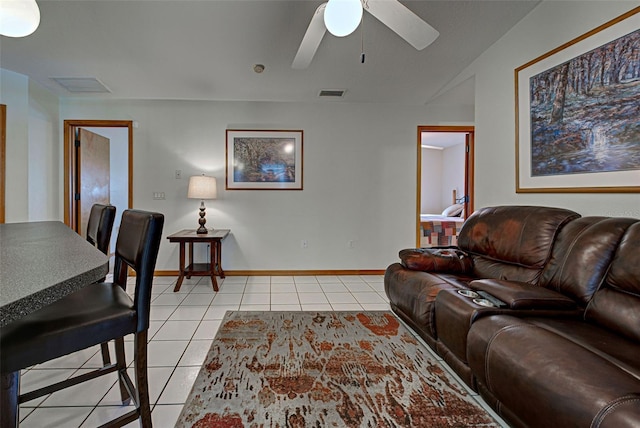 living room with light tile patterned flooring and ceiling fan