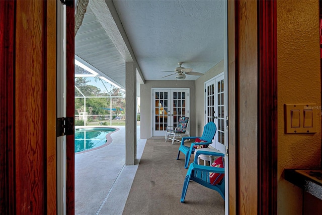 view of patio featuring a lanai