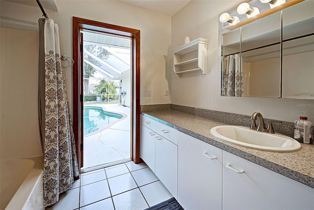 bathroom featuring tile patterned flooring, vanity, and shower / bath combination with curtain