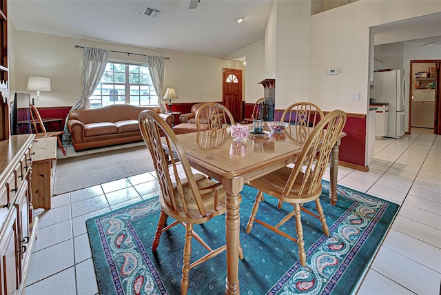 dining area featuring light tile patterned floors