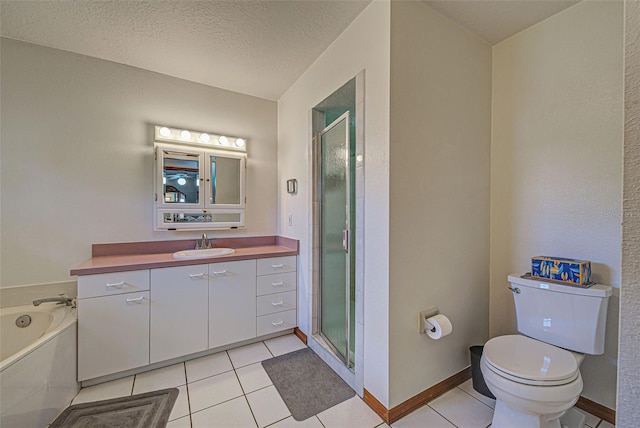 full bathroom with vanity, toilet, a textured ceiling, and tile patterned flooring