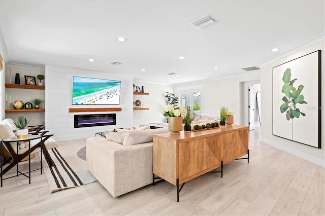 living room with crown molding, a fireplace, and light wood-type flooring