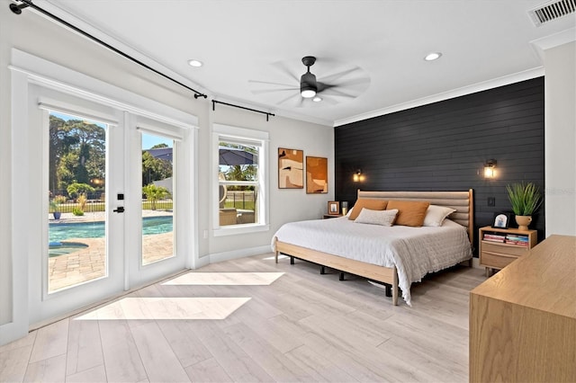 bedroom with french doors, ceiling fan, access to exterior, and crown molding