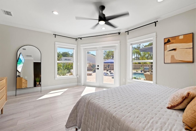 bedroom featuring crown molding, ceiling fan, light hardwood / wood-style flooring, and access to outside