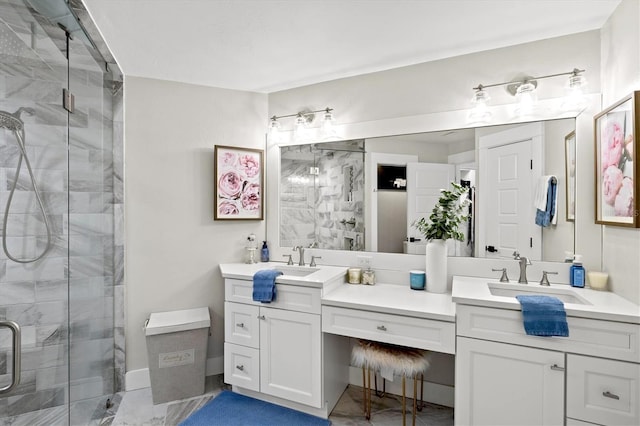 bathroom featuring vanity and a shower with shower door