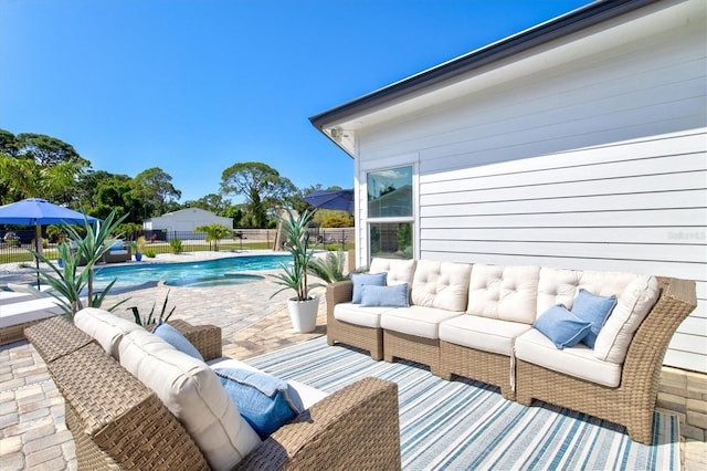 view of patio with a fenced in pool and outdoor lounge area