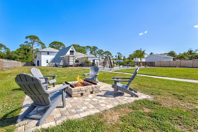 view of yard with a patio area and an outdoor fire pit