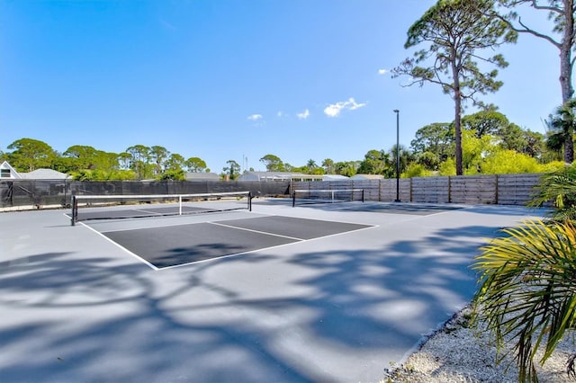 view of sport court featuring basketball hoop