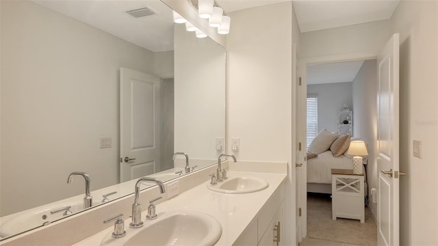 bathroom with vanity and tile patterned floors