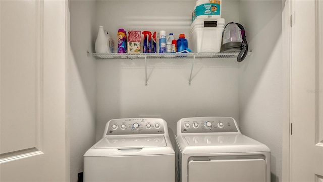 laundry room with washing machine and dryer