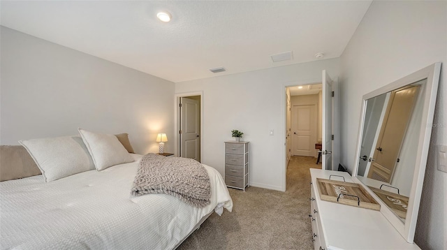 bedroom featuring light carpet