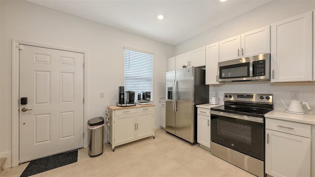 kitchen with white cabinetry and stainless steel appliances