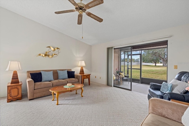 living room with ceiling fan, light carpet, vaulted ceiling, and a textured ceiling