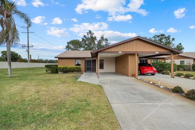 ranch-style home with a front yard and a carport