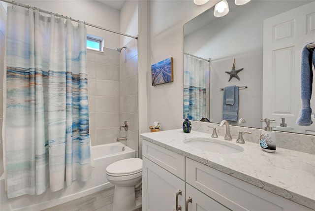 full bathroom featuring shower / bath combo, vanity, and toilet