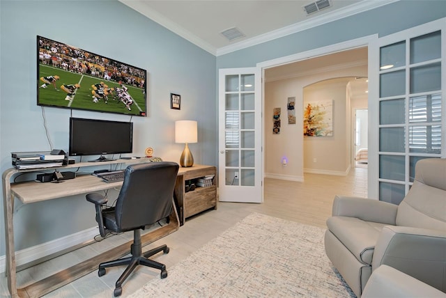 office featuring crown molding, wood-type flooring, and french doors