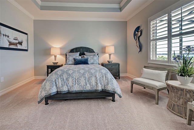 bedroom with a raised ceiling, ornamental molding, and carpet floors