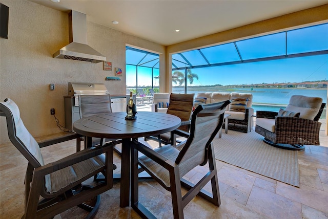 dining area featuring a water view