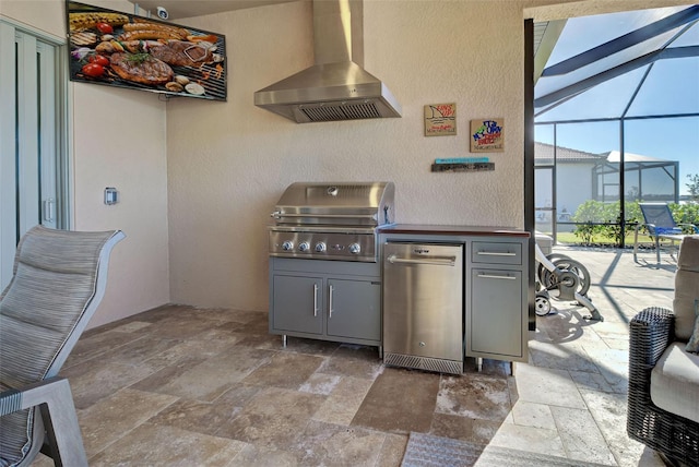 view of patio with an outdoor kitchen, a grill, and a lanai