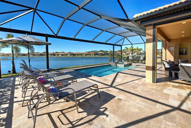 view of swimming pool with a water view, a patio, a lanai, and an in ground hot tub