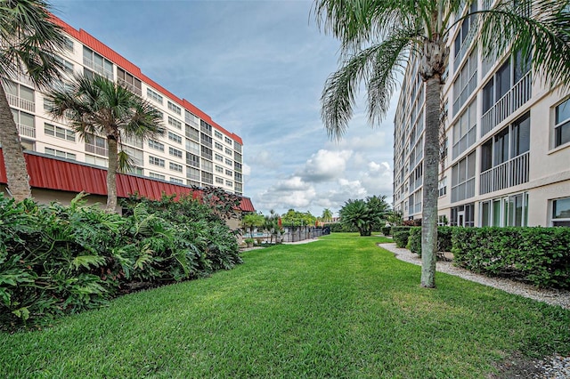 view of property's community featuring a yard