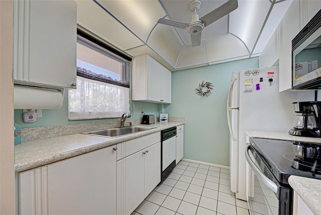 kitchen with light tile patterned floors, sink, white cabinetry, and appliances with stainless steel finishes