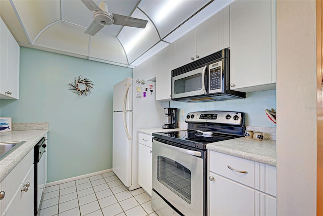 kitchen with light tile patterned flooring, stainless steel appliances, and white cabinetry