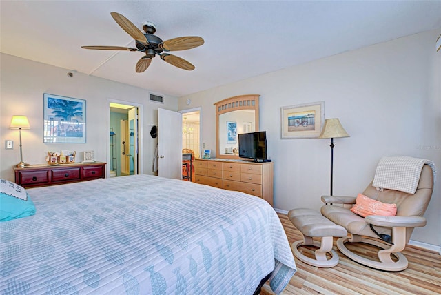 bedroom with ceiling fan and light hardwood / wood-style floors