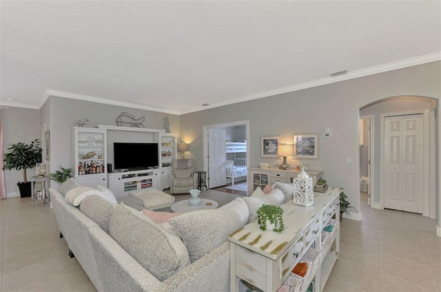 tiled living room featuring ornamental molding