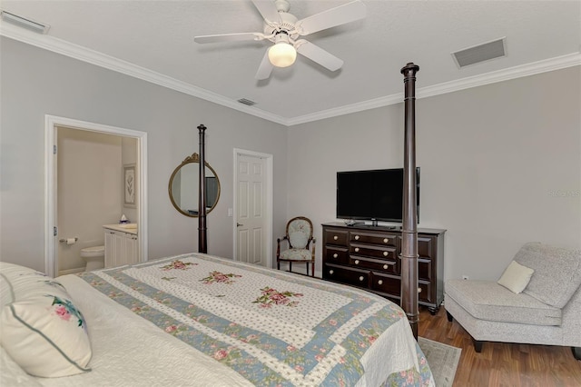 bedroom featuring ceiling fan, ornamental molding, ensuite bathroom, and hardwood / wood-style floors